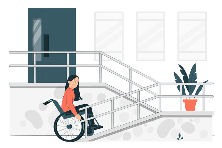 Illustration of a person in a wheelchair accessing a building via a ramp